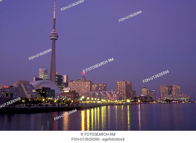 Canada, Ontario, Toronto, Skyline of downtown Toronto and CN Tower reflect in the waters of Lake Ontario in the evening