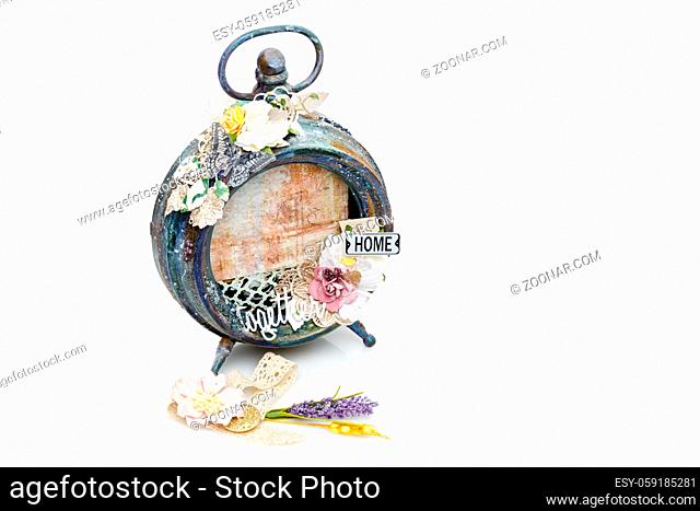 Beautiful handmade photo frame with paper details made from vintage alarm clock. Scrapbooking. Isolated on white. Copy space. Square composition