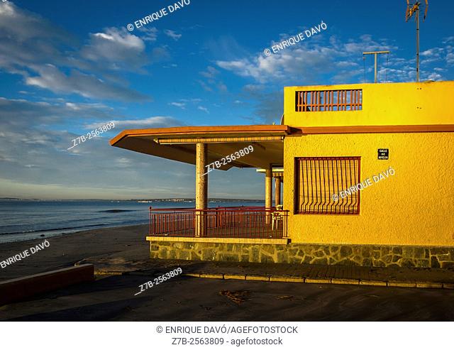 A yellow side house in Playa Lisa beach, Alicante coast, Spain
