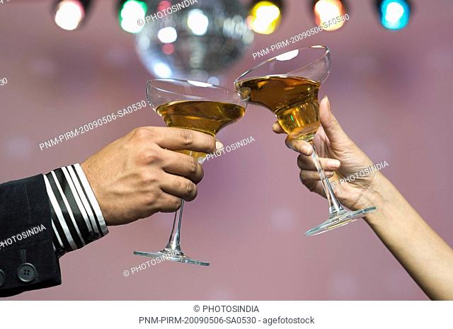 Couple toasting their wine glasses