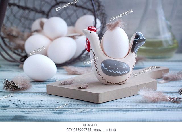 Eggs in handmade hens trays over the wooden background. Easter postcared concept