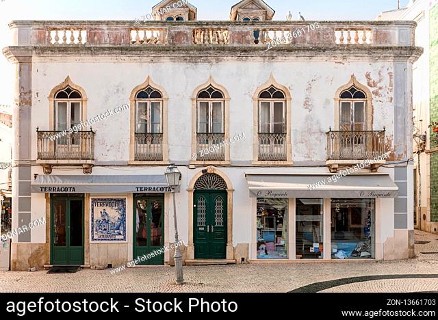 Old building include a store and Azulejo at the facade on the Luis de Camoes Square in Lagos, Portugal