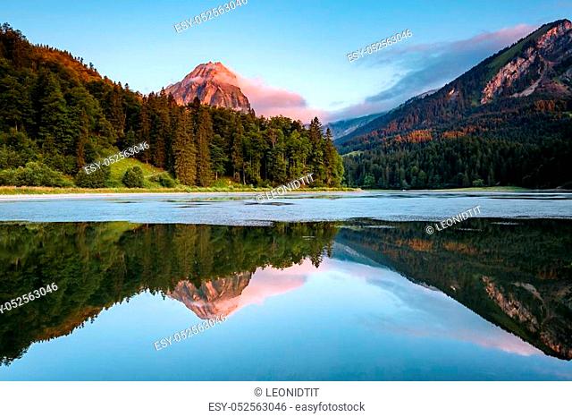 Great view of the azure pond Obersee glowing by sunlight. Popular tourist attraction. Picturesque and gorgeous scene. Location famous place Nafels, Mt