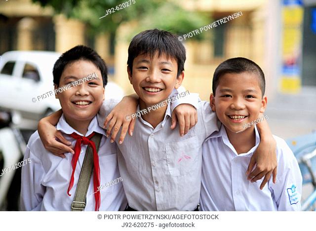 Portrait of three boys after school. The Old Quarter, Hanoi, Vietnam, Indochina, Southeast Asia, Asia 2006