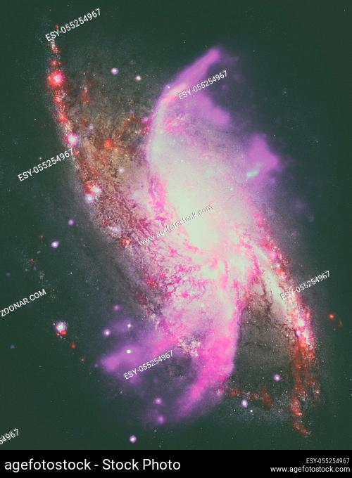 Spiral galaxy M106. It located in the constellation Canes Venatici. NGC 4258 is a spiral galaxy like the Milky Way. Retouched colored image