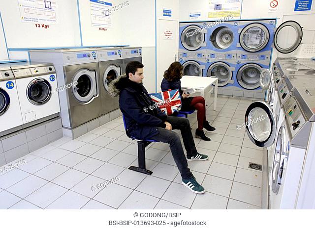 Teenagers in a laundromat