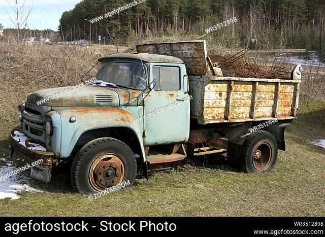 The old rusty forgotten soviet mass production truck of the middle of the twentieth century waits for utilization
