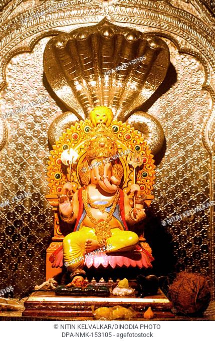 Richly decorated idol of lord Ganesh elephant headed God ; Ganapati festival year 2008 at Pune ; Maharashtra ; India