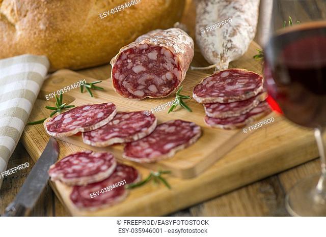 French salami Sausage on a wooden table, France
