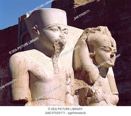 Egypt - Ancient Thebes (UNESCO World Heritage List, 1979). Luxor. Temple of Amon. Limestone statuary group of Tutankhamen and Queen