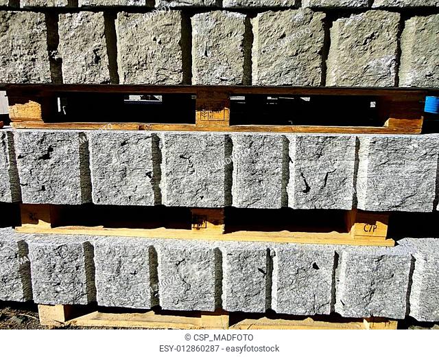 Rough blocks of granite in a yard