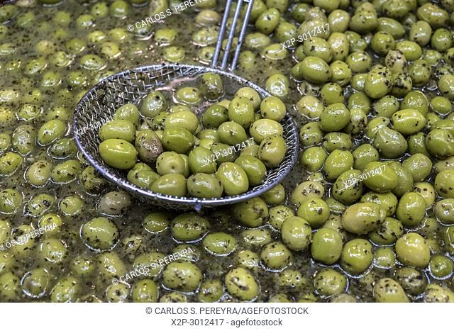 Sale of olives in the iron and glass roof of the""Les Halles"" market in Narbonne France built in 1907