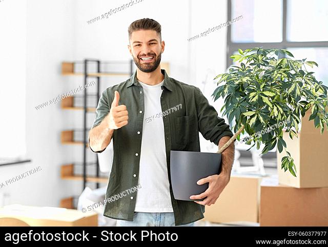 happy man with flower moving to new home