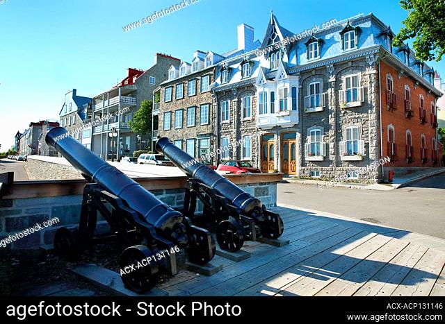 Two canons positioned above an opening in the north facing fortification of Old Quebec City. Running along the edge of the fortification is rue des Remparts and...