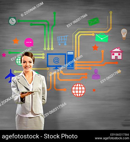 Businesswoman presenting tablet pc and color icons at background