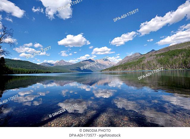 Clouds reflecting in Kitla lake in Glacier national park , USA United States of America