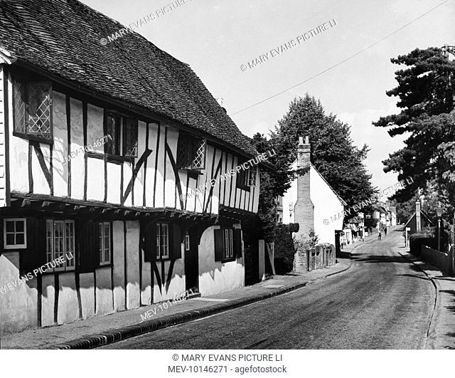 Picturesque black and white timber and plaster cottages in the street at Much Hadham, a charming Hertfordshire village