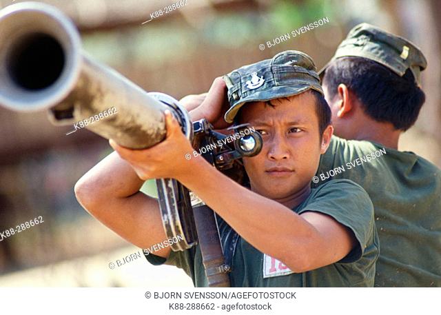 Officer cadets during weapon training with a grenade launcher. KNLA (Karen National Liberation Army) headquarter. Kawthoolei (Karen State)
