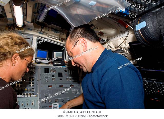 NASA astronaut Mark Polansky, STS-127 commander; and Canadian Space Agency astronaut Julie Payette, mission specialist, are pictured on the aft flight deck of...