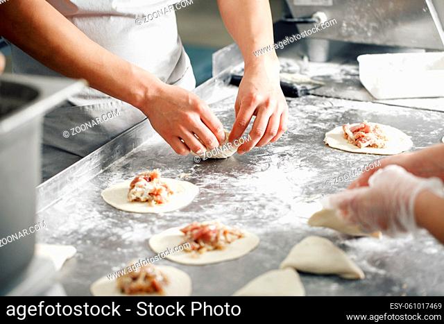 Selective focus. billet bun of dough with filling inside. Prepared for baking in baking production. manufacturing of food products