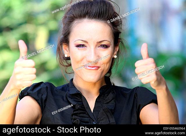 young woman, enthusiastic, thumbs up