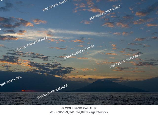 View at sunset from the distance of Sangeang Api Volcano Island near Sumbawa Island, Lesser Sunda Islands, Indonesia