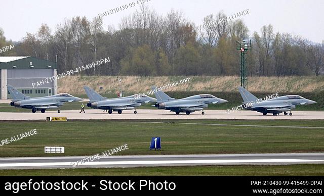 30 April 2021, Mecklenburg-Western Pomerania, Laage: At Tactical Air Squadron 73 ""Steinhoff"", Eurofighters from the German Air Force Weapons School (WaSLw)...
