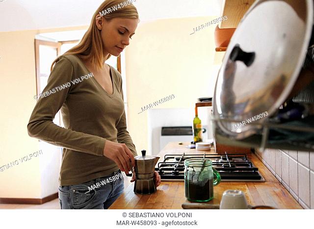 woman in the kitchen preparing coffee