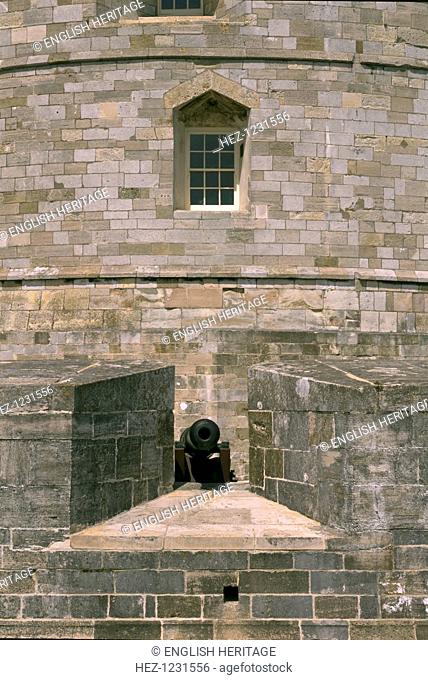 Gun embrasure at Calshot Castle, Hampshire, 1995. One is seen here complete with cannon. In the 1770s the curtain wall was lowered and the heads were removed...