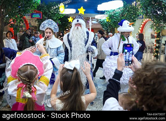 RUSSIA, MOSCOW - DECEMBER 4, 2023: Performers dressed as Father Frost (Russia equivalent of Santa), Snow Maid and Snowman entertain children during a ceremony...