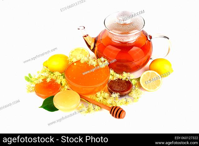 Herbal tea with linden flowers and different kinds of fresh honey on a white background