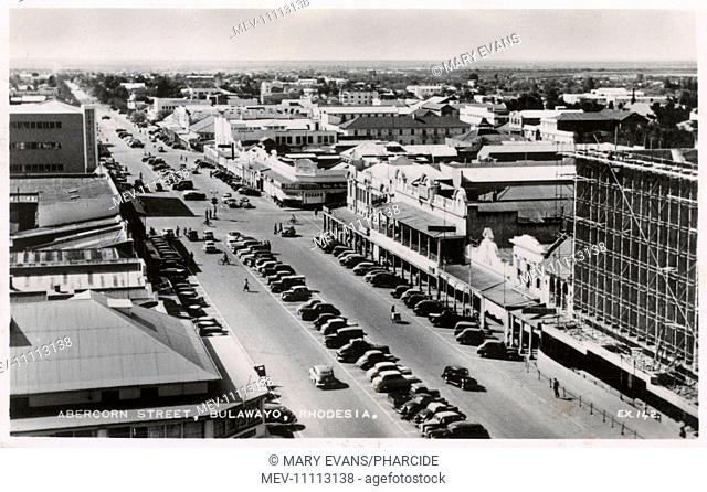 Aerial view of Abercorn Street, Bulawayo, Southern Rhodesia (now Zimbabwe), with many parked cars and a few pedestrians