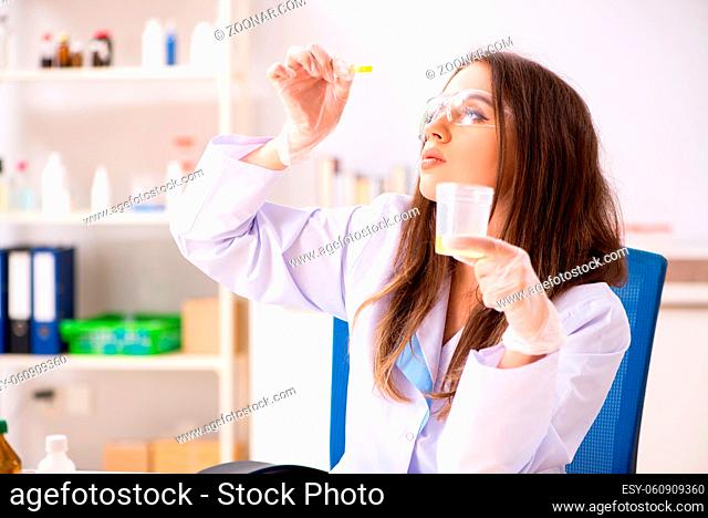 Female beautiful biochemist working in the lab