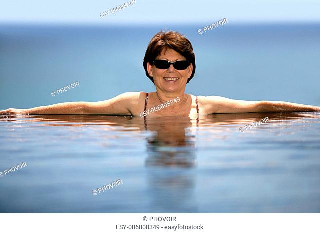 Woman in an infinity pool