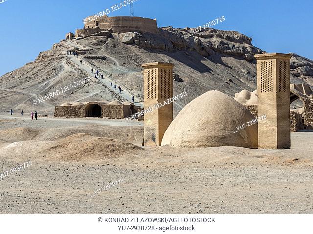 Water reservoir with wind catchers on the area of Zoroastrian Tower of Silence (seen on background), ancient burial place in Yazd, Iran