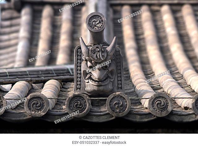 Japanese traditional antique ceramic roof with onigawara gargoyle