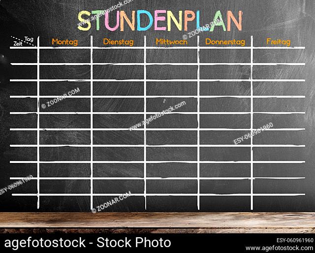 school timetable or class schedule with word STUNDENPLAN, German for schedule, template on blackboard