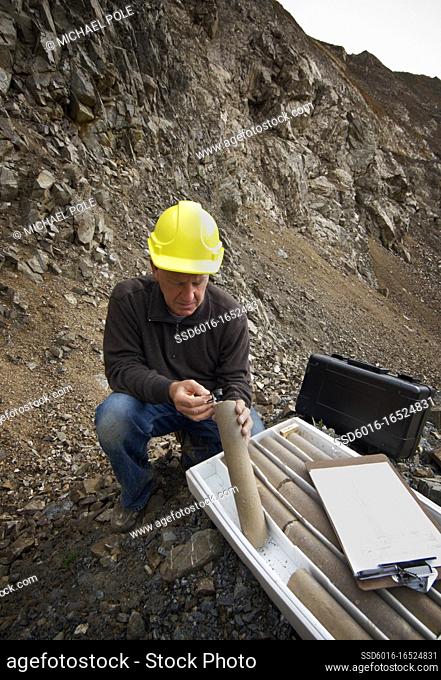 Senior geologist studying core samples in a Quarry