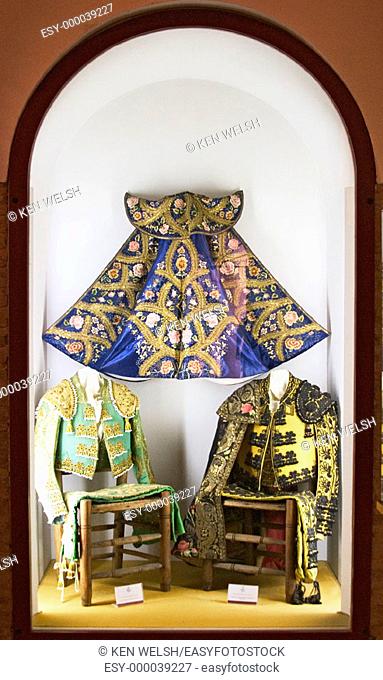 Bullfighter costumes and 'capote' in Maestranza bullring museum. Seville. Andalusia, Spain