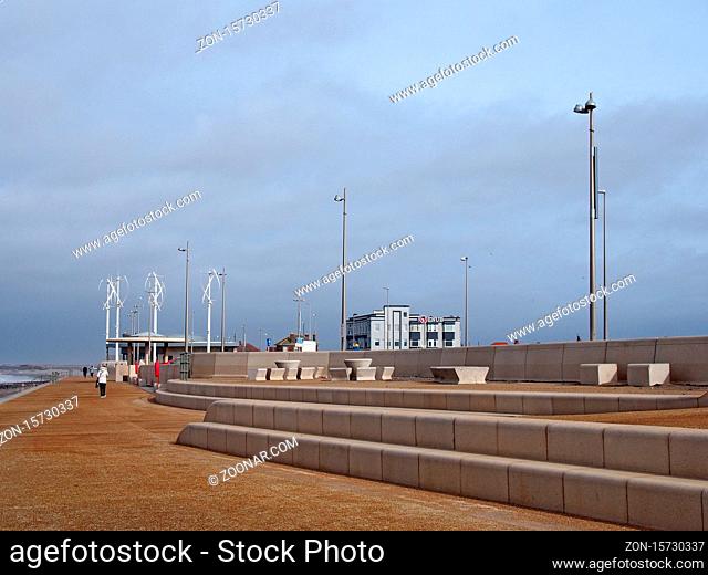 Blackpool, Lancashire, United Kingdom - 6 March 2020: people on the promenade along the seafront at cleveleys in blackpool with steps leading to the beach and...
