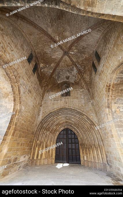 Lateral door of the Cathedral in Santo Domingo de la Calzada, Wooden door inform of arch under de dome in the way of st james, La Rioja, Spain, Europe