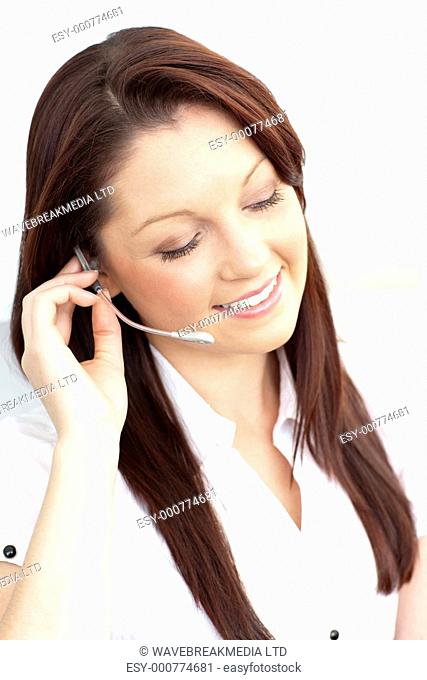 Delighted businesswoman wearing headphones against a white background