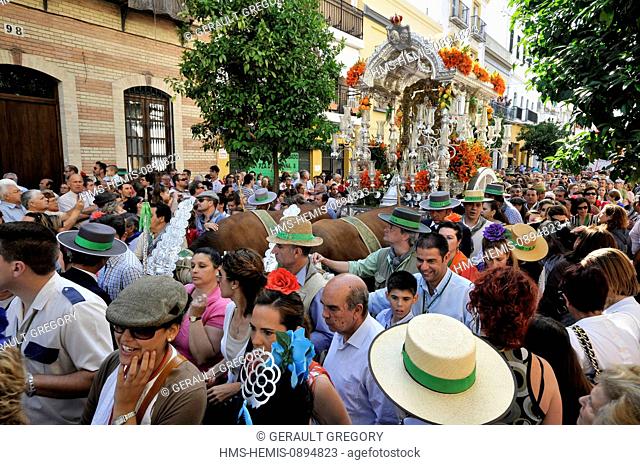 Spain, Andalucia, Seville, Triana, the departure of the Brotherhood Hacia Rocio pilgrimage to El Rocio, Spain's largest, crowd in the street