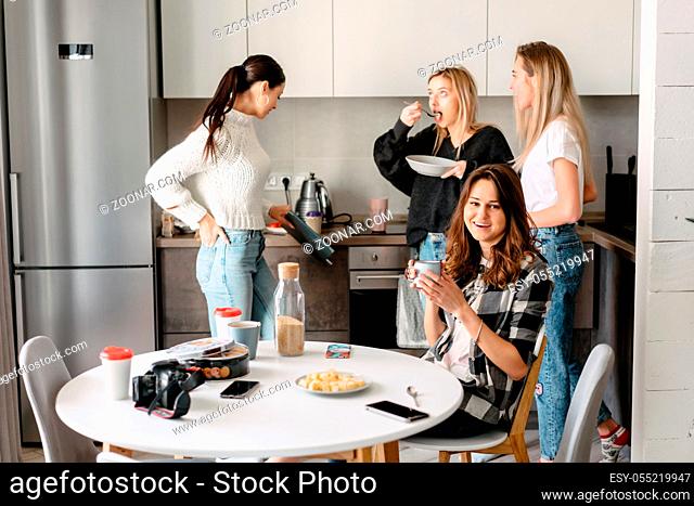 group of women having fun in the kitchen