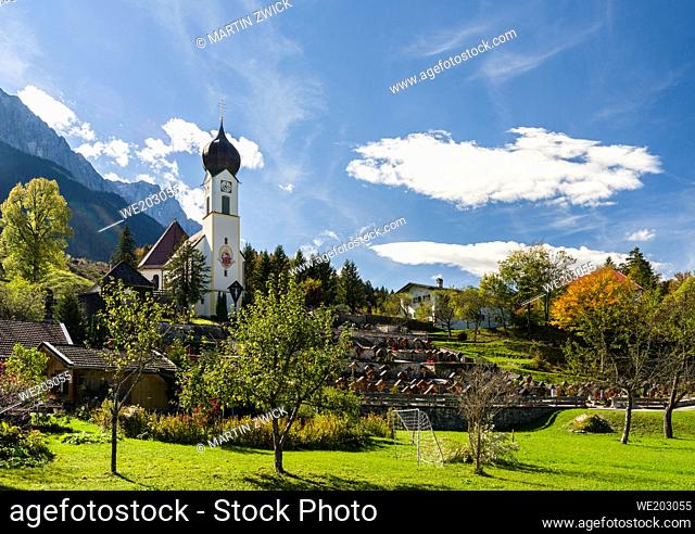 Church St. Johannes der Taeufer (John the Baptist), Mount Zugspitze in the background. Village Grainau near Garmisch-Partenkirchen and mount Zugspitze in the...