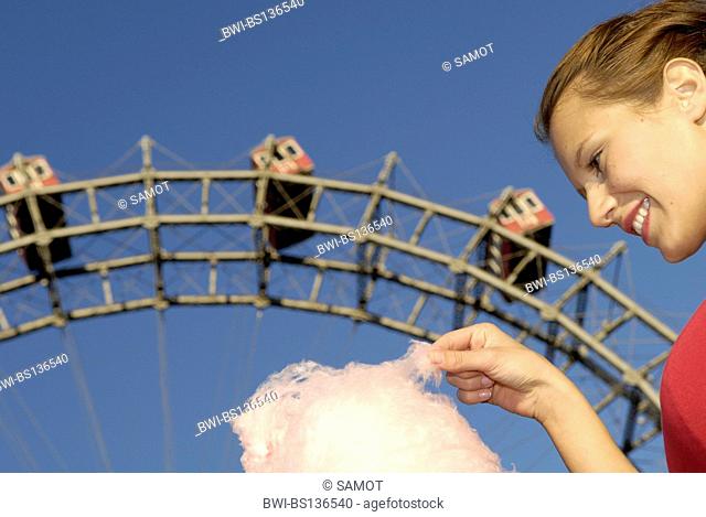 amusement park Prater Vienna, young woman with candy floss, Austria, Vienna