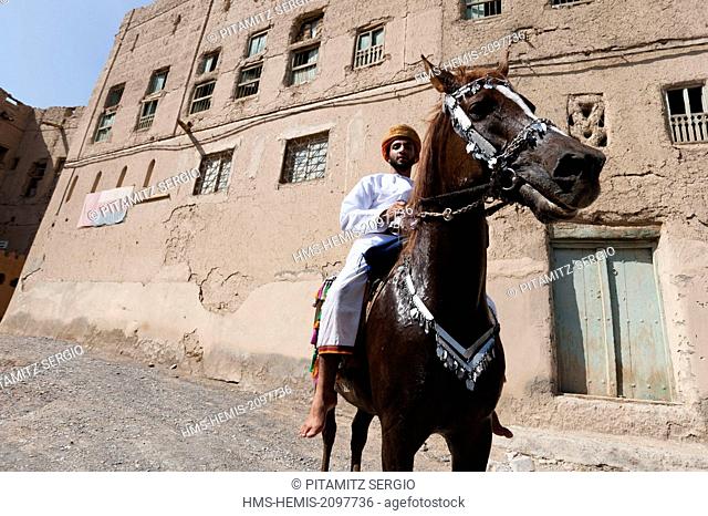 Oman, Al Hamra, Man in traditional dresses