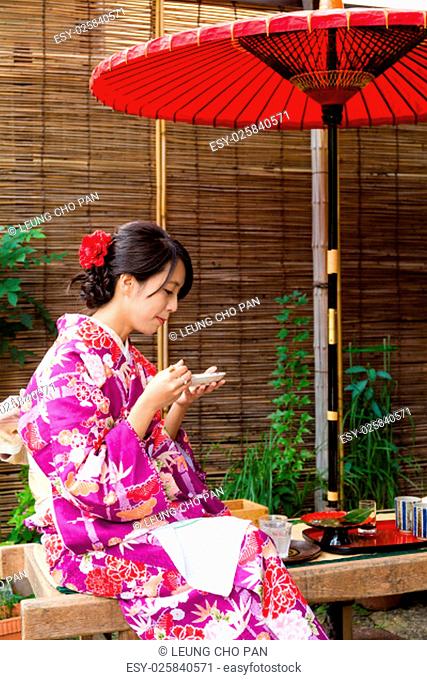 Young woman having the dessert in tea house