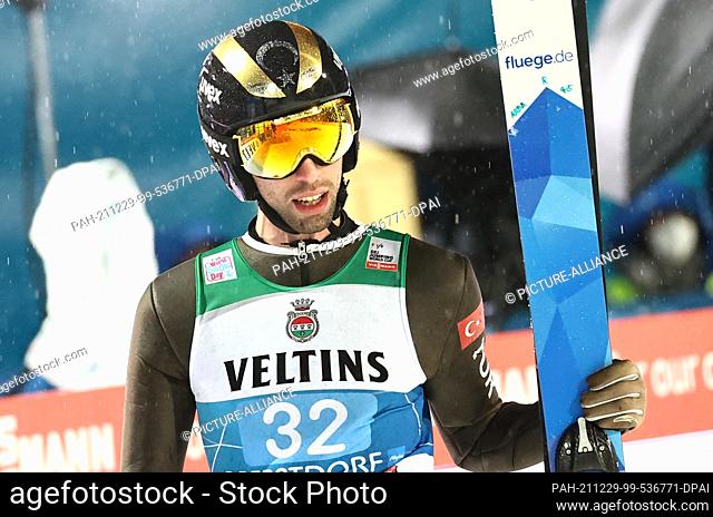 29 December 2021, Bavaria, Oberstdorf: Nordic skiing/ski jumping: World Cup, Four Hills Tournament. Fatih Arda Ipcioglu from Turkey reacts after his jump in the...