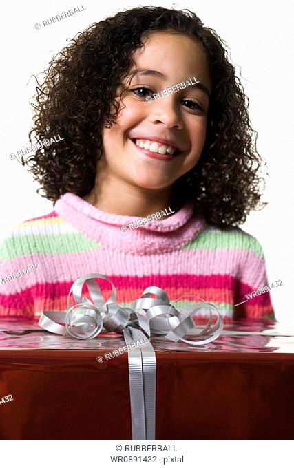 Close-up of a girl holding a gift box